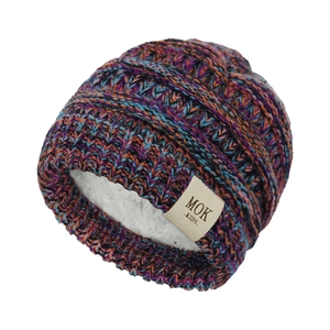 Detail view of colorful knit baby hat with warm white fleece lining and MOK label