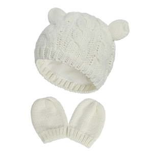 Detailed view of cream-white knitted baby hat with cute ears and matching gloves set