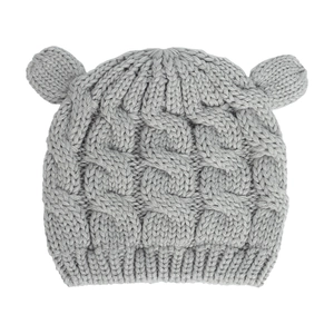 Detail of grey knitted baby hat featuring cable knit texture and cute animal ears