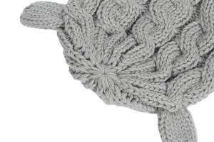 Close-up of grey cable knit baby hat featuring cute pointed ears and thick texture