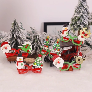 Five assorted Christmas glitter glasses with Santa, Snowman and Reindeer festive designs
