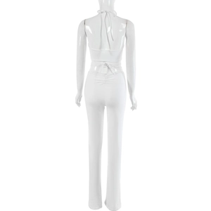 Detailed back view of white jumpsuit with adjustable lace-up design and ruched details
