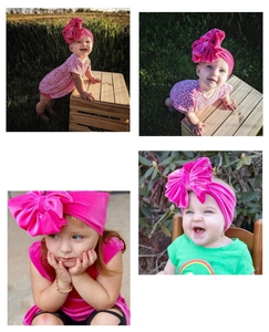 Detail of rose pink velvet infant headband featuring an oversized bow for baby girls