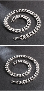 Detail of silver Cuban link chain with polished finish and secure lobster clasp closure