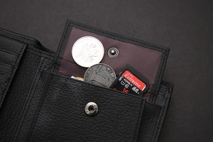 Detail view of black genuine leather wallet with coin pocket and SD card storage slot