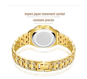 Detailed back view of gold-tone watch with crystal links and stainless steel caseback
