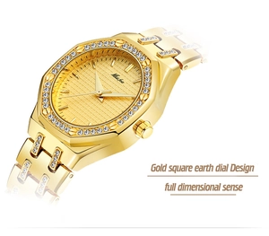 Detail view of gold octagonal women's watch with shimmering crystals and metal band