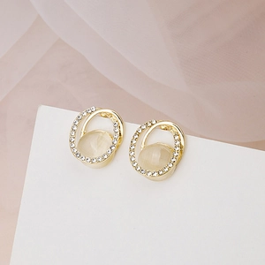 Elegant gold drop earrings with cat eye stone and sparkling rhinestone halo design
