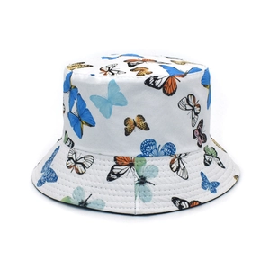 Detail of white cotton bucket hat featuring colorful butterfly prints and neat stitching