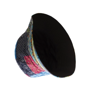 Detail view of colorful patchwork sun hat showing geometric patterns and black lining
