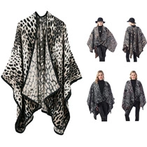 Detail of leopard print knit poncho with high neck and contrast black piping detail