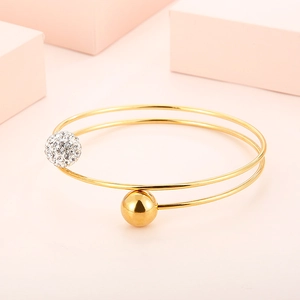 Gold double-layered stainless steel bangle with crystal pave ball and smooth metal bead