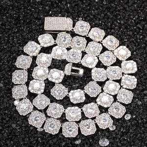 Detailed macro view of iced-out hip hop square links necklace with silver finish