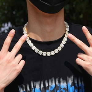 Close-up of men's hip hop gold chain with square cubic zirconia links on a model