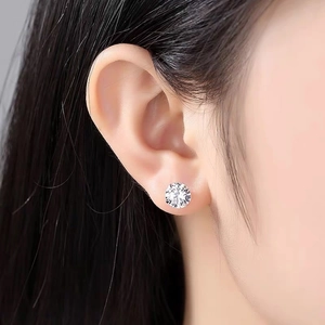 Close-up of S999 sterling silver stud earring with four-claw round cubic zirconia