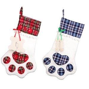 Red and blue plaid Christmas stockings in paw shapes with bone and fishbone charms