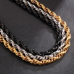 Detailed close-up of twisted rope chain necklaces in gold, silver, and black titanium steel