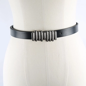 Close-up of black leather belt with silver metallic caterpillar snap buckle detail