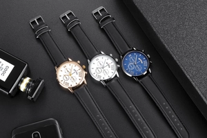 Close-up of three men's quartz watches with Roman numerals and black leather straps