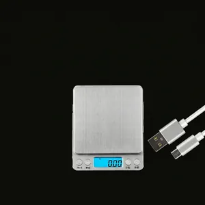 Waterproof digital kitchen scale with stainless steel surface and blue LCD backlit display
