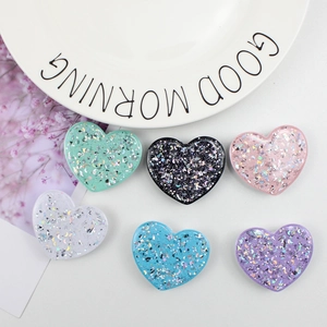 Vista plana de soportes para móvil de corazón con purpurina y lentejuelas en seis colores