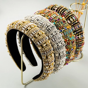 Close-up of wide knotted headbands with luxury crystal rhinestones in varied colors