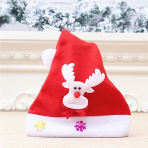 Close-up of a red velvet Christmas hat with a cute white reindeer and snowflake motifs