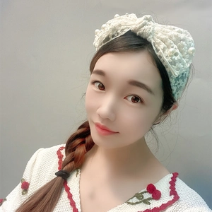White lace bow headband with pearl accents and floral embroidery for women