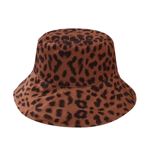 Detail of double-sided leopard print bucket hat featuring durable canvas fabric and neat stitching