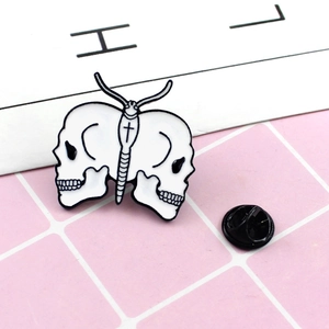 White enamel skull butterfly brooch with black cross pattern for denim jackets