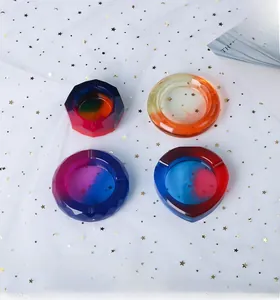 Set of four gradient resin ashtrays in geometric shapes with gold star glitter details