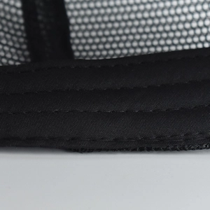 Close-up of black mesh breathable fabric and precision triple stitching on a baseball cap