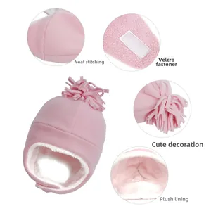 Detail of pink fleece toddler winter hat with earflaps, soft lining and velcro closure