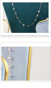 Detail of irregular amethyst stones on a gold chain displayed on premium velvet stands