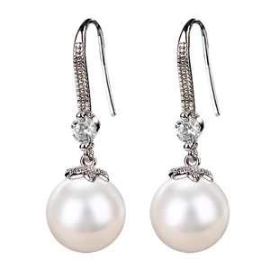 Elegant pearl drop earrings with sparkling cubic zirconia pavé hooks on a clean white backdrop