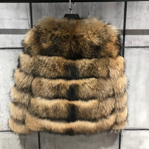 Detailed view of brown and black faux fur texture on a textured industrial background