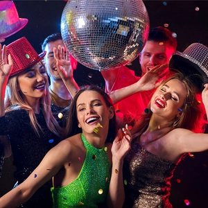 Lively party scene with people dancing under a disco ball and colorful confetti atmosphere