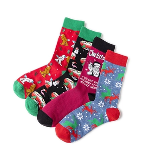 Set of 4 festive Christmas crew socks in red, black, and blue with holiday patterns