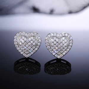 Detailed close-up of heart stud earrings with silver plating and sparkling pavé zircons