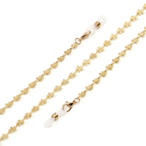 Golden anti-slip metal eyeglass chain with intricate floral links and silicone loops