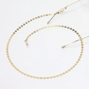 Golden flower chain glasses strap with non-slip silicone loops on white background