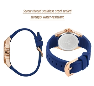 Detail view of water-resistant stainless steel case back and blue silicone watch strap