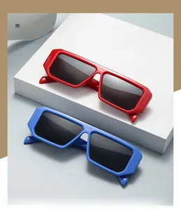 Detail of trendy thick-frame square sunglasses in vibrant red and blue colors