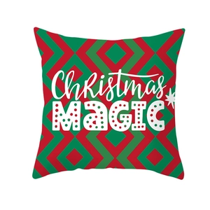 Detail of red and green geometric pillowcase with Christmas MAGIC text and star