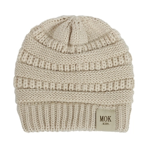 Macro detail of beige knit baby hat featuring horizontal wave texture and leather MOK label