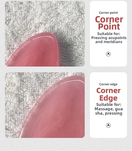 Detailed view of pink resin gua sha tool showing pressure points and massage edges