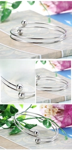 Detail view of double-layer stainless steel bead bracelet with a polished silver finish