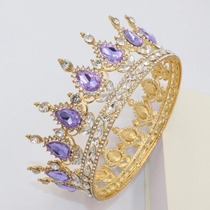 Detailed close-up of a baroque gold tiara featuring large pear-shaped purple gemstones