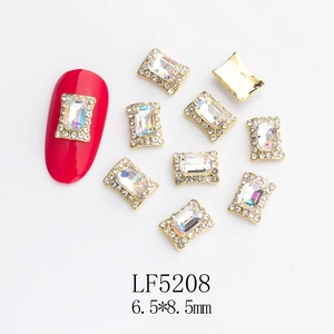 Detailed view of rectangle K9 crystal nail charm with gold alloy base and 6.5x8.5mm size