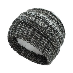 Detailed close-up of thick winter knit beanie with warm white fleece lining for toddlers